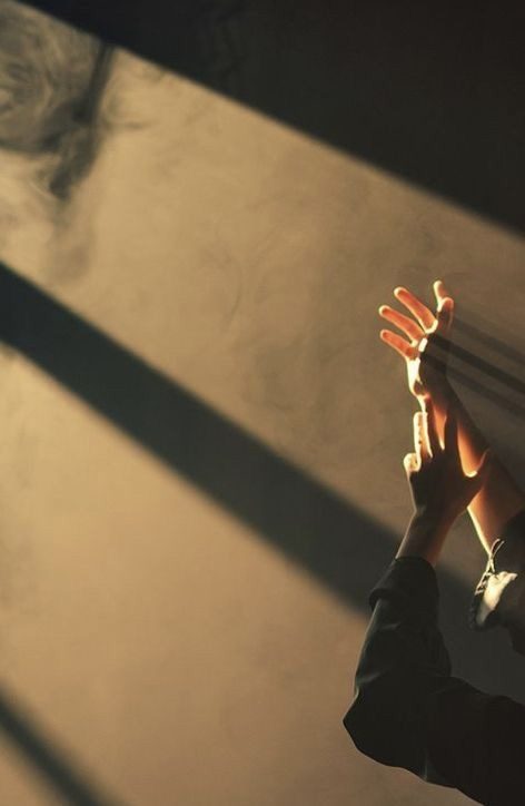 Reference photo: a hand reaching into light